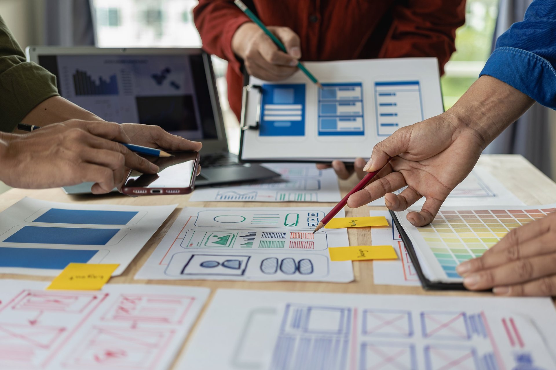 Web design team collaborating on website development